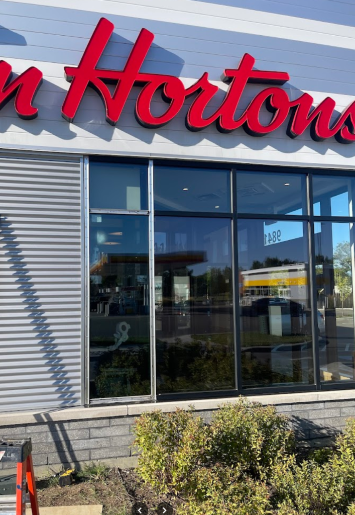 Commercial storefront with full-height glass panels